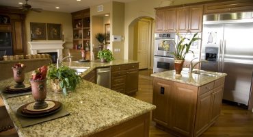Luxury home kitchen with a granite top island.