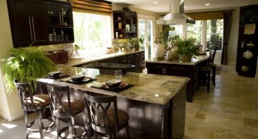 Luxury kitchen with a granite breakfast counter.