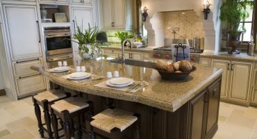 Luxury home kitchen with a granite island.